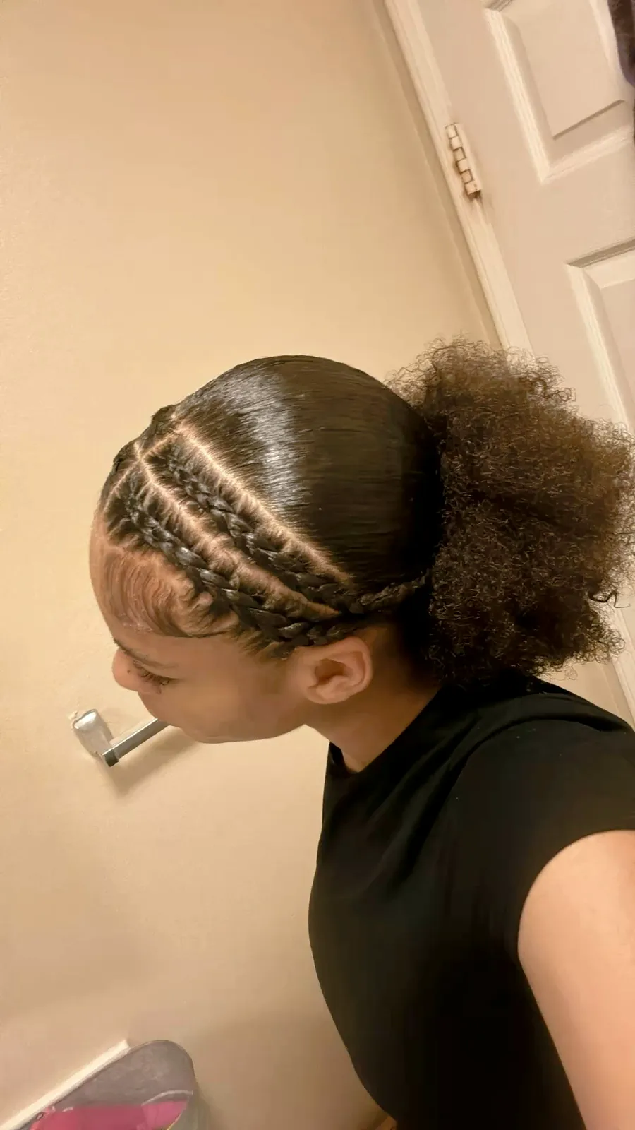 Cornrowed front gathered into a coily puff